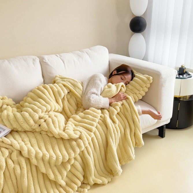 Soft fuzzy throw blanket on a sofa - product photo 9