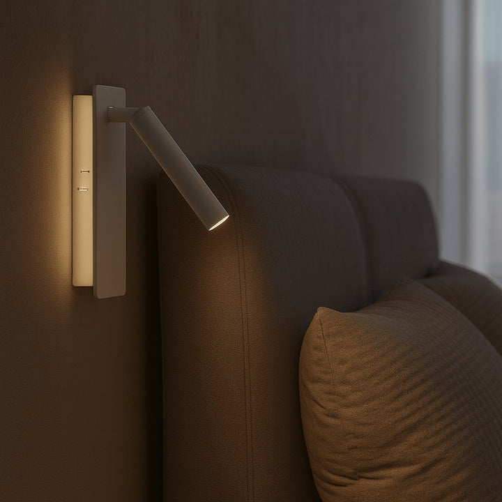 Swivel LED bedside reading light aimed at a book - product photo 1