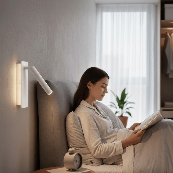 Swivel LED bedside reading light aimed at a book - product photo 2