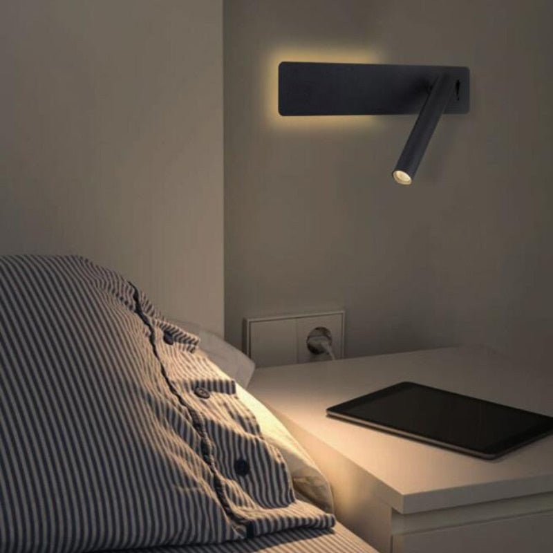 Swivel LED bedside reading light aimed at a book - product photo 3