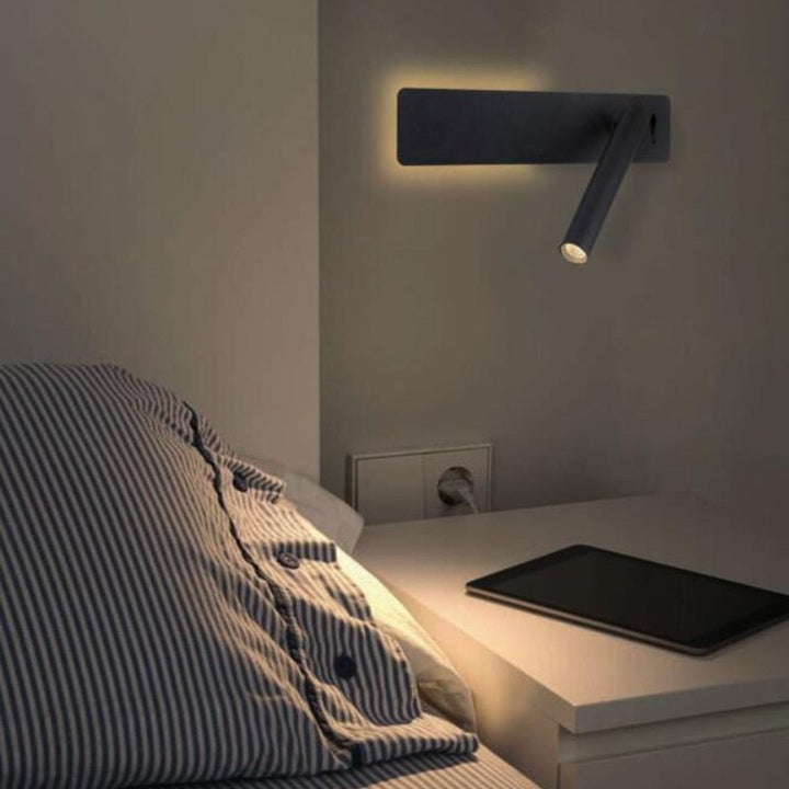 Swivel LED bedside reading light aimed at a book - product photo 3