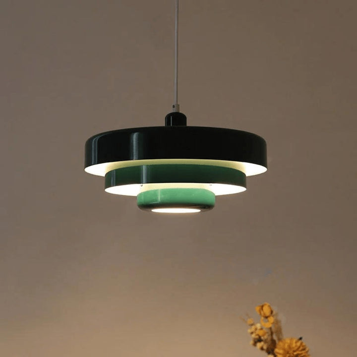 Three-tier pendant light with soft pastel shades over a table - product photo 1