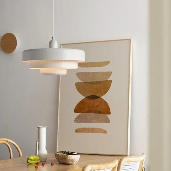 Three-tier pendant light with soft pastel shades over a table - product photo 3