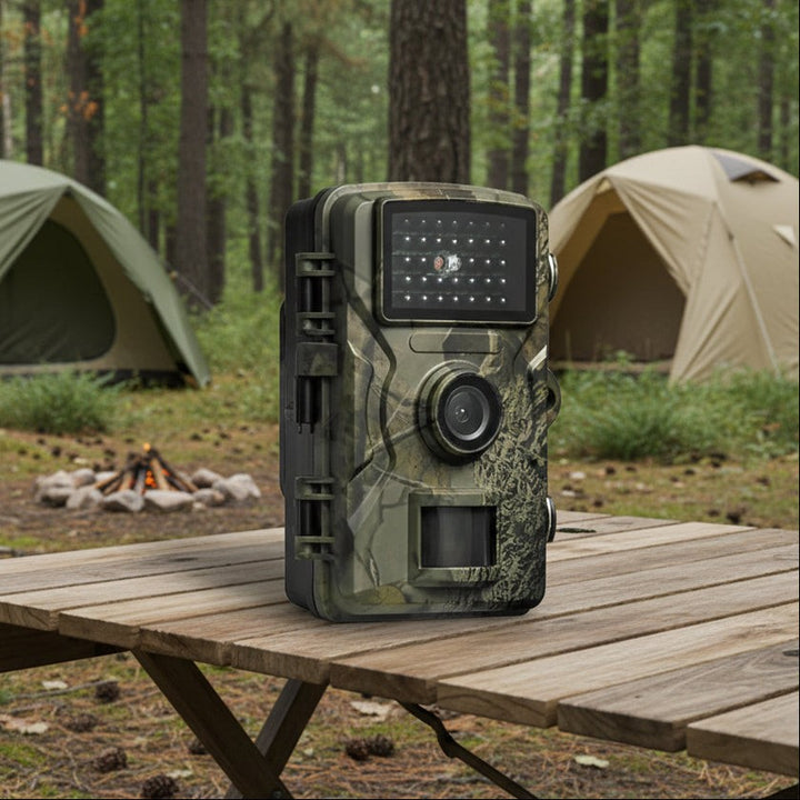 Camouflaged trail camera with infrared night vision strapped to a tree - product photo 1