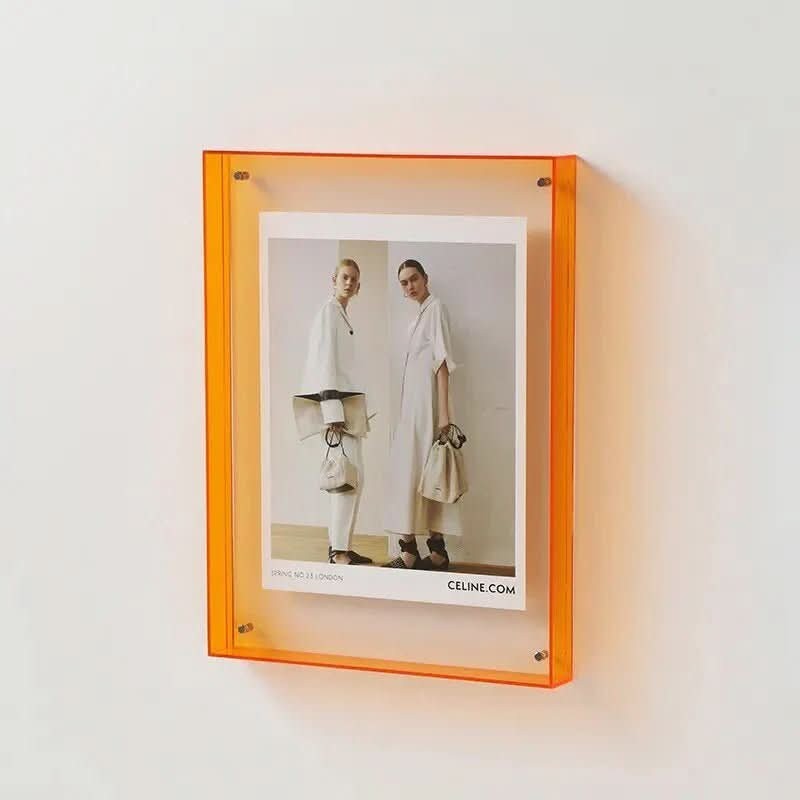 Transparent colored acrylic photo frame holding a photo - product photo 1