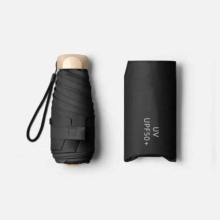 Ultra-compact folding umbrella beside its storage sleeve - product photo 2