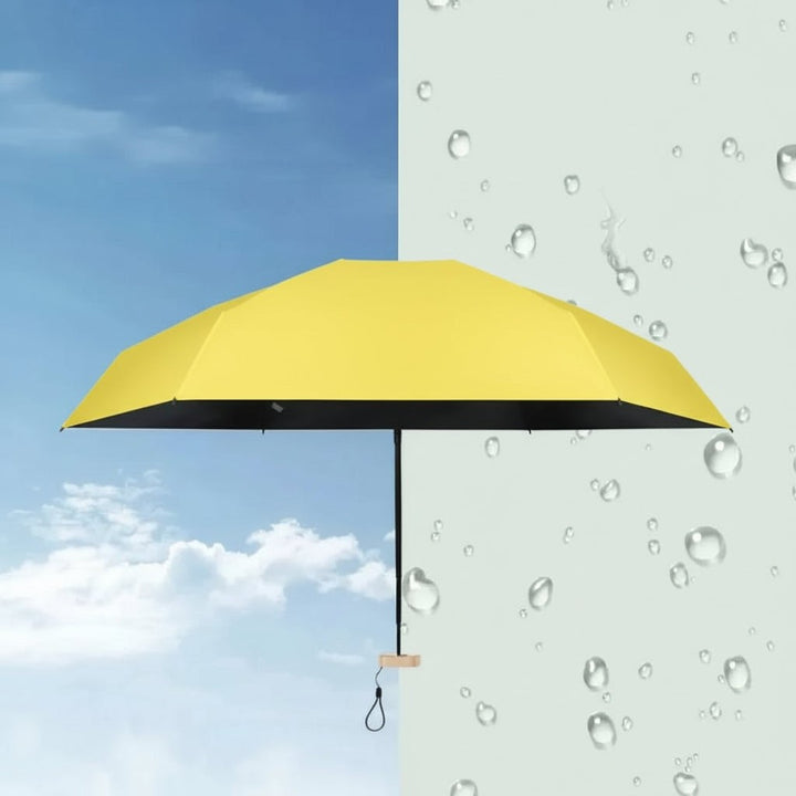 Ultra-compact folding umbrella beside its storage sleeve - product photo 3