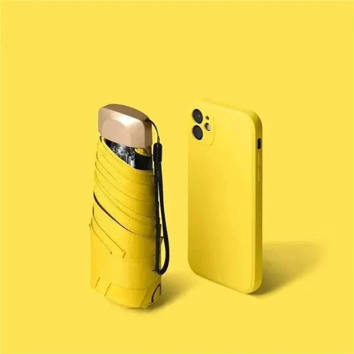 Ultra-compact folding umbrella beside its storage sleeve - product photo 8