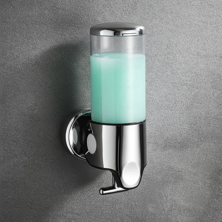 Wall-mounted stainless steel soap dispenser above a basin - product photo 15