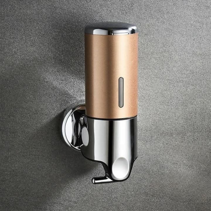 Wall-mounted stainless steel soap dispenser above a basin - product photo 21