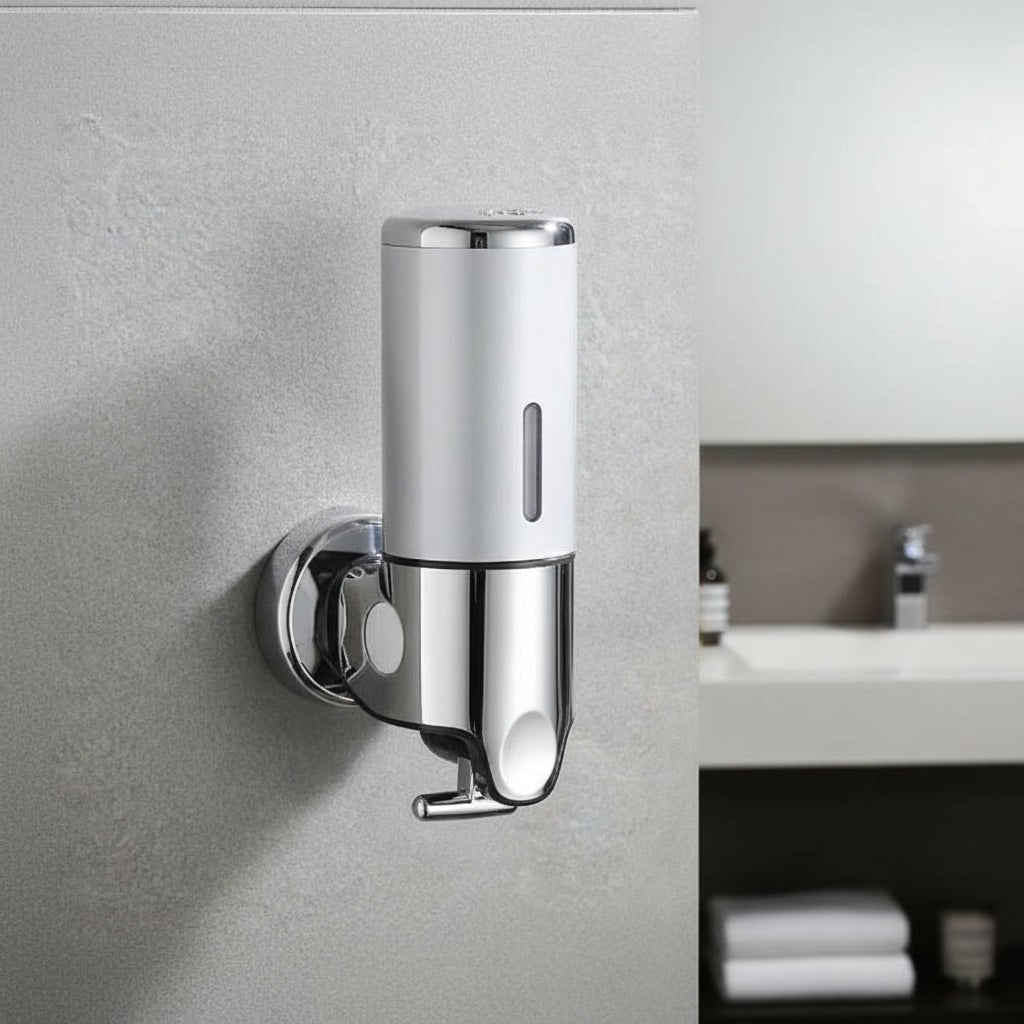 Wall-mounted stainless steel soap dispenser above a basin - product photo 3