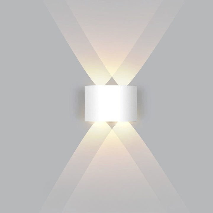 Weatherproof LED outdoor wall light casting an even glow on a wall - product photo 10