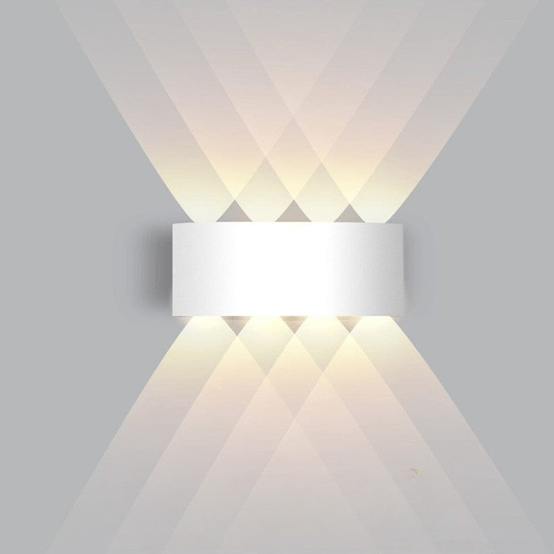 Weatherproof LED outdoor wall light casting an even glow on a wall - product photo 11