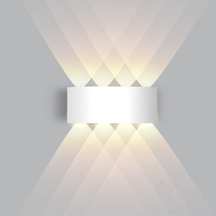 Weatherproof LED outdoor wall light casting an even glow on a wall - product photo 11