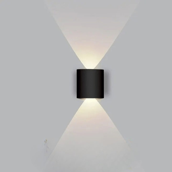 Weatherproof LED outdoor wall light casting an even glow on a wall - product photo 12