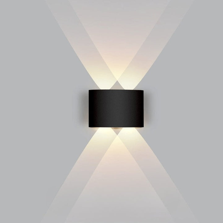 Weatherproof LED outdoor wall light casting an even glow on a wall - product photo 13