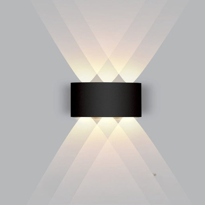 Weatherproof LED outdoor wall light casting an even glow on a wall - product photo 14