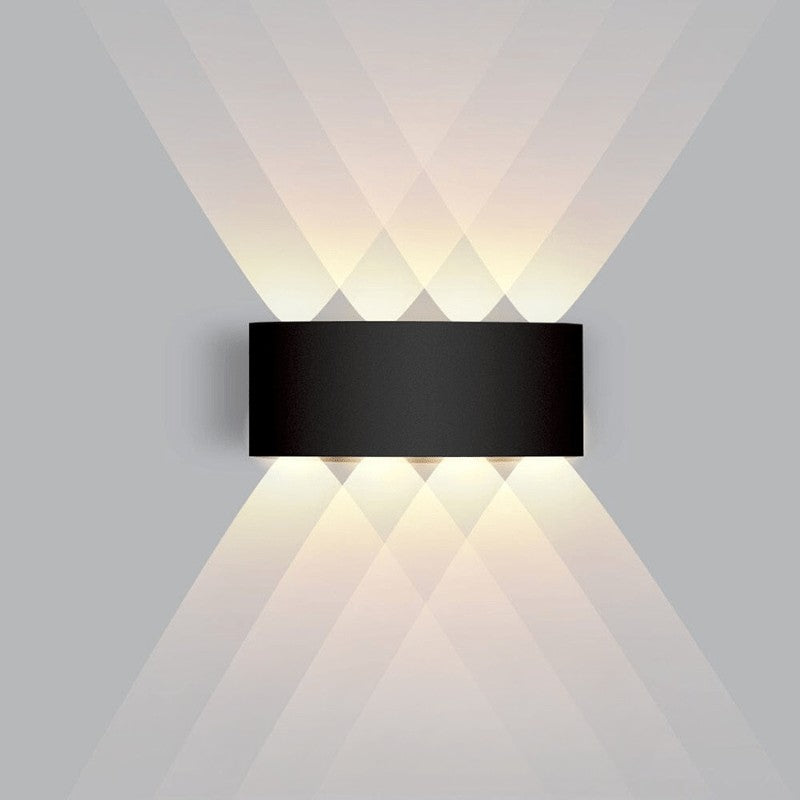 Weatherproof LED outdoor wall light casting an even glow on a wall - product photo 15