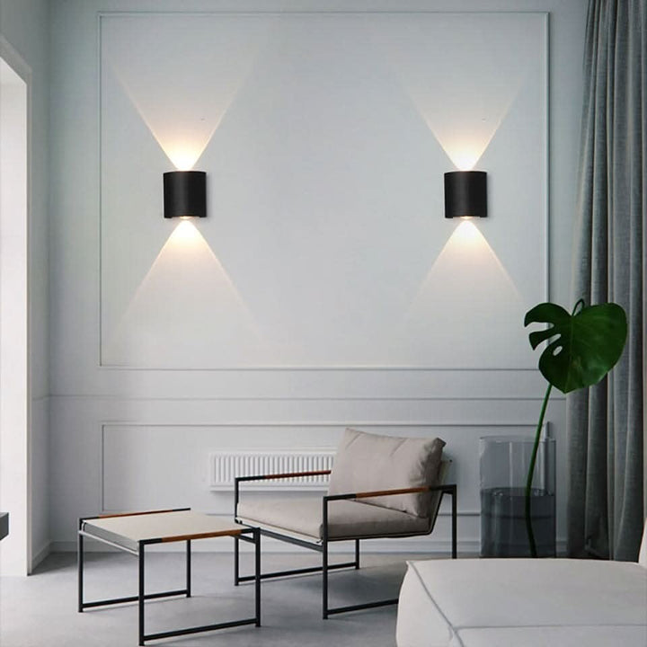 Weatherproof LED outdoor wall light casting an even glow on a wall - product photo 4