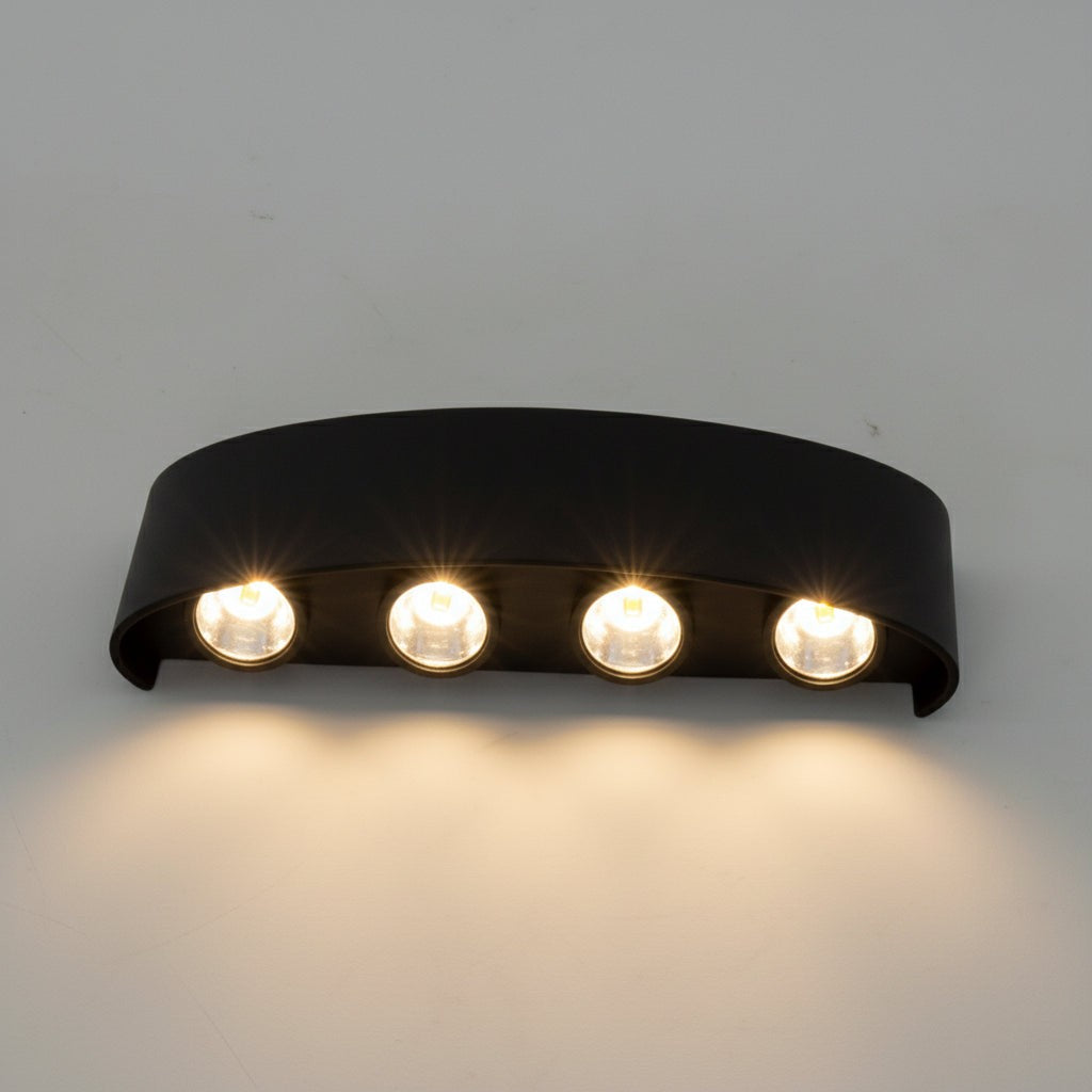 Weatherproof LED outdoor wall light casting an even glow on a wall - product photo 6