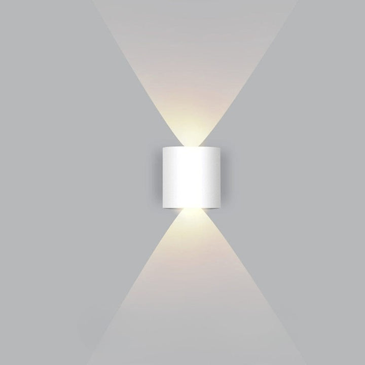 Weatherproof LED outdoor wall light casting an even glow on a wall - product photo 7