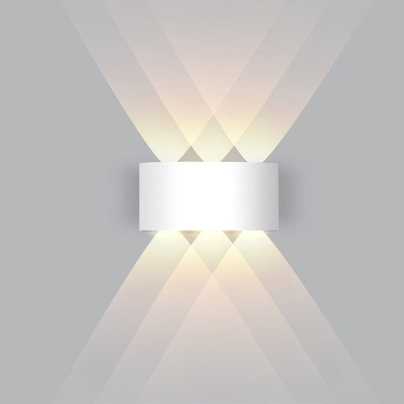 Weatherproof LED outdoor wall light casting an even glow on a wall - product photo 9