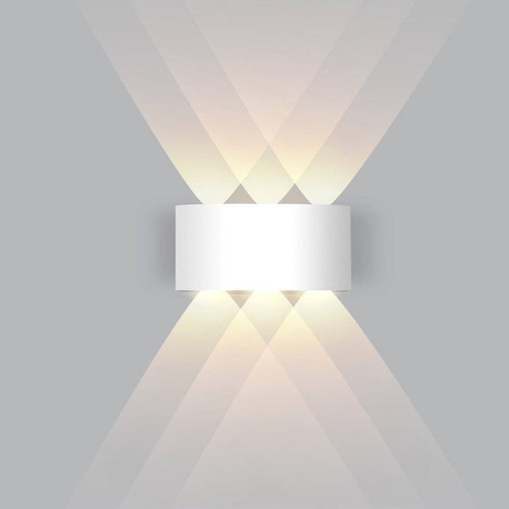Weatherproof LED outdoor wall light casting an even glow on a wall - product photo 9