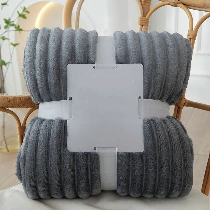 Wide striped flannel fleece blanket on a sofa - product photo 5