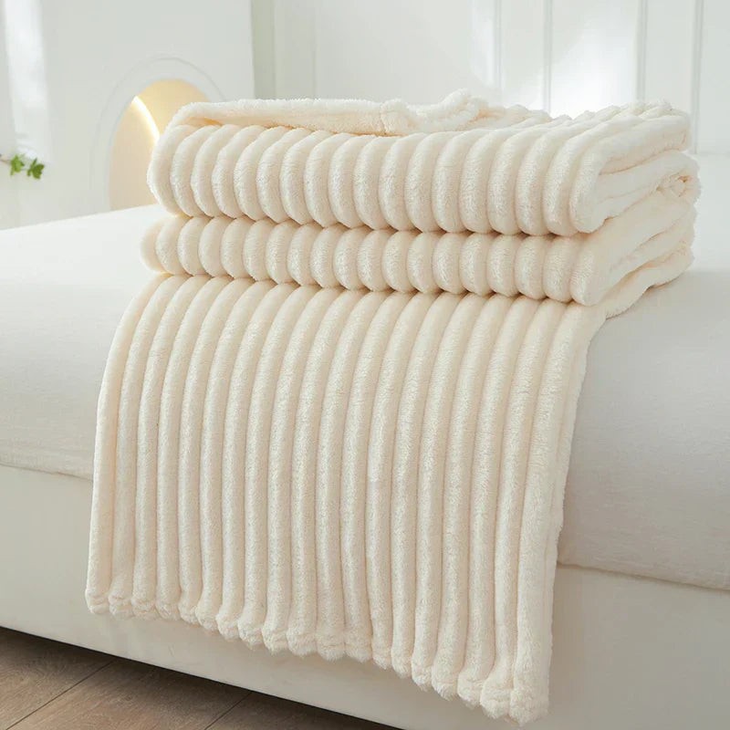 Wide-stripe flannel fleece blanket on a sofa - product photo 1