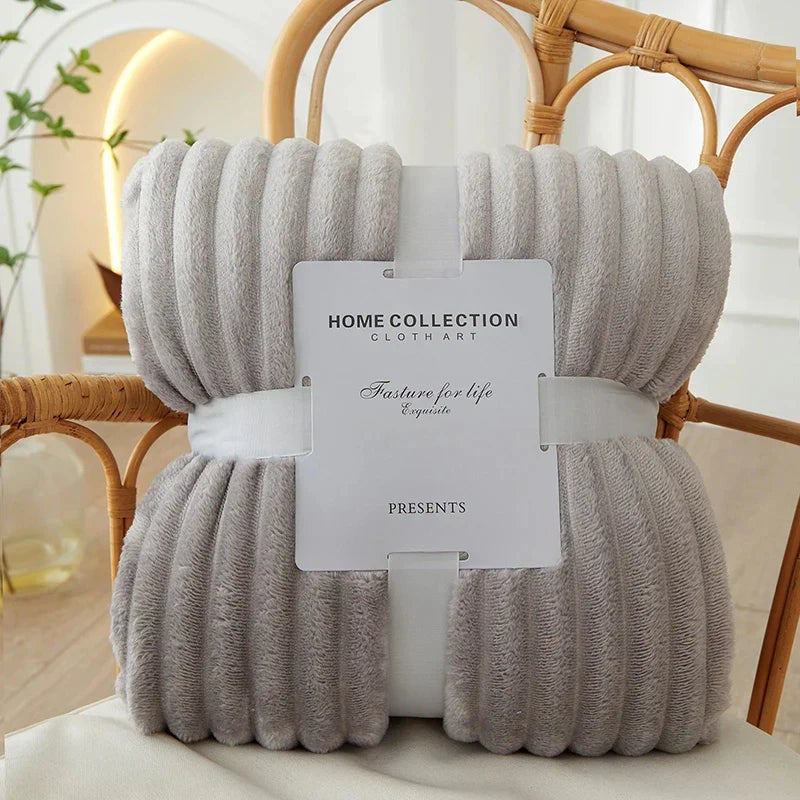 Wide-stripe flannel fleece blanket on a sofa - product photo 11