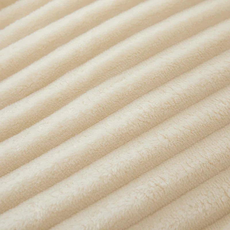 Wide-stripe flannel fleece blanket on a sofa - product photo 17