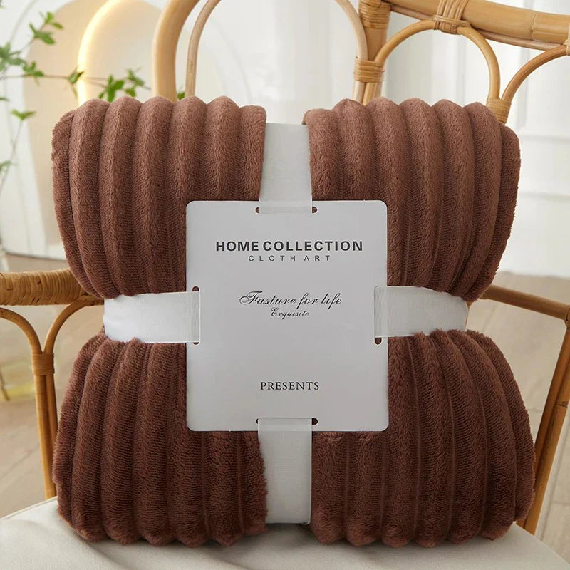 Wide-stripe flannel fleece blanket on a sofa - product photo 3