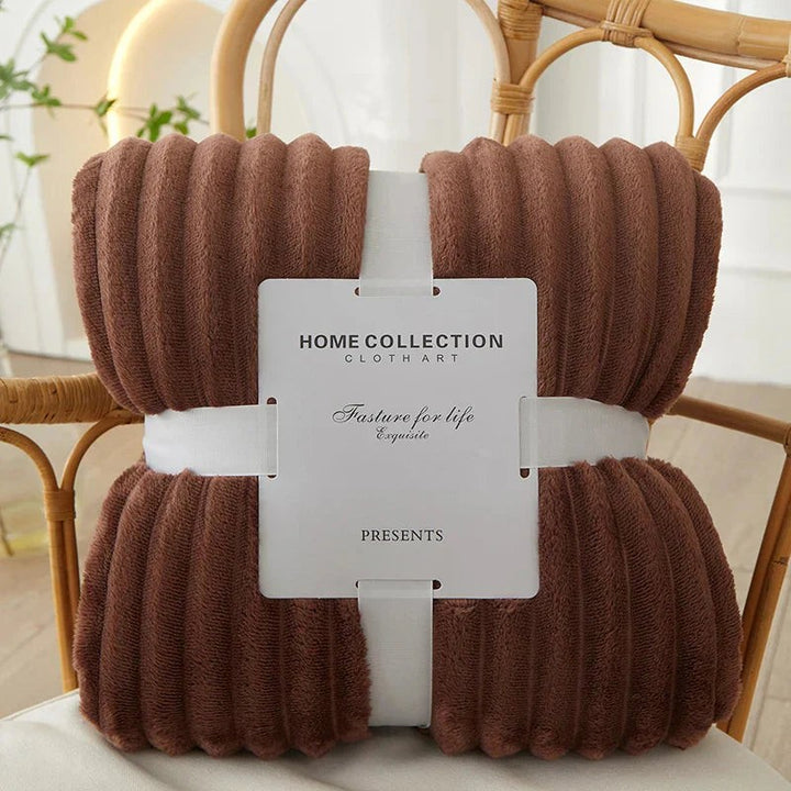 Wide-stripe flannel fleece blanket on a sofa - product photo 3