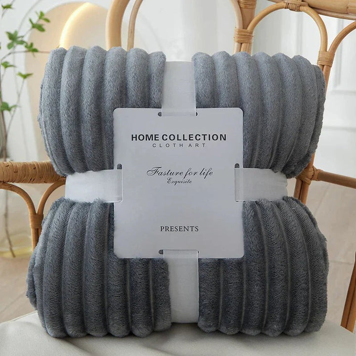 Wide-stripe flannel fleece blanket on a sofa - product photo 4