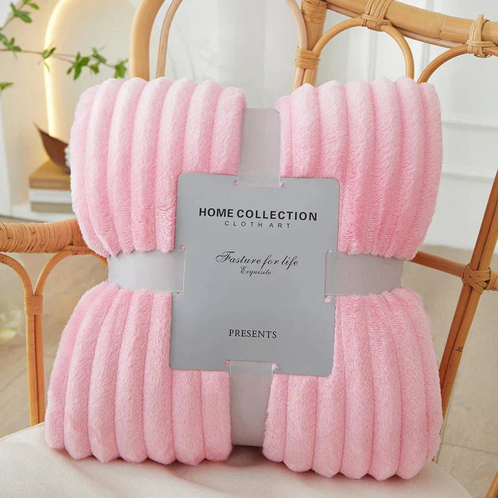 Wide-stripe flannel fleece blanket on a sofa - product photo 9