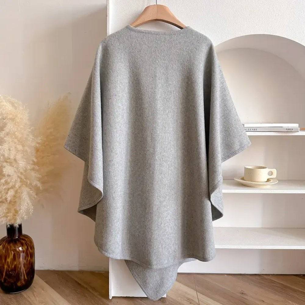 Wool-blend poncho wrap draped over the shoulders - product photo 9