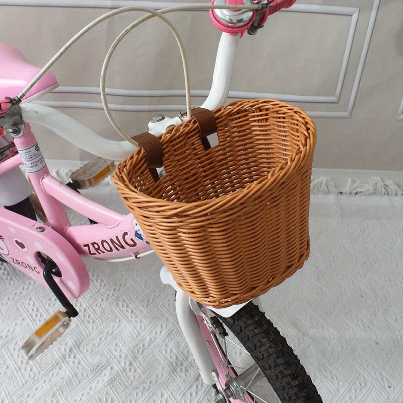 Woven bicycle basket mounted on a child's bike - product photo 9