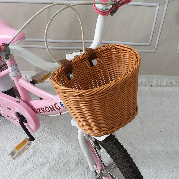 Woven bicycle basket mounted on a child's bike - product photo 9