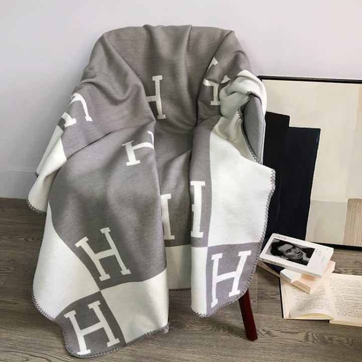 Woven throw blanket draped over a sofa - product photo 12
